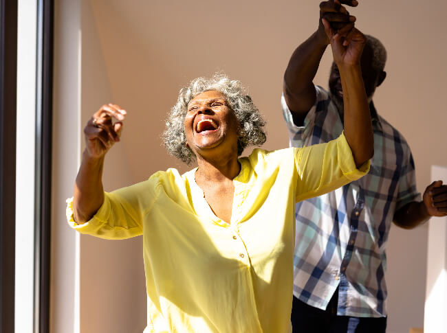 an older couple dancing and enjoying it