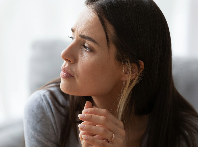 A woman in deep thought