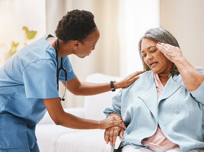 A medical professional taking care of an elderly.