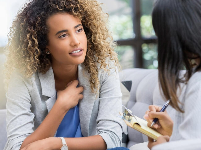 woman sharing her feelings with a mental health professional