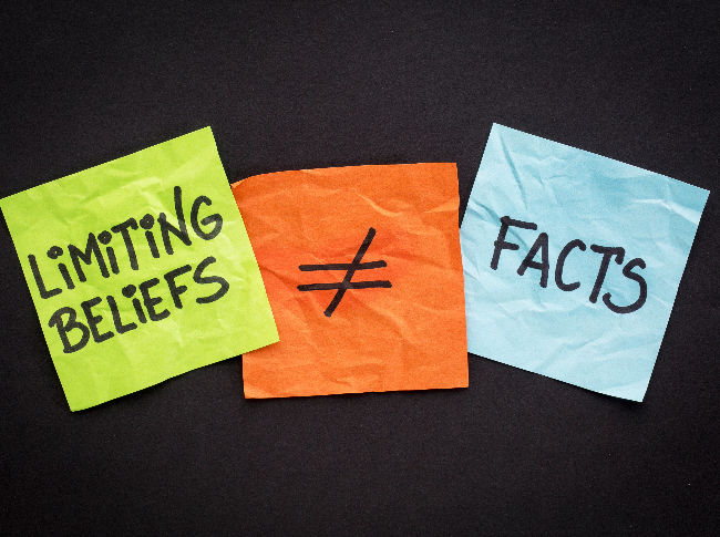 sticky notes that says limiting beliefs are not facts